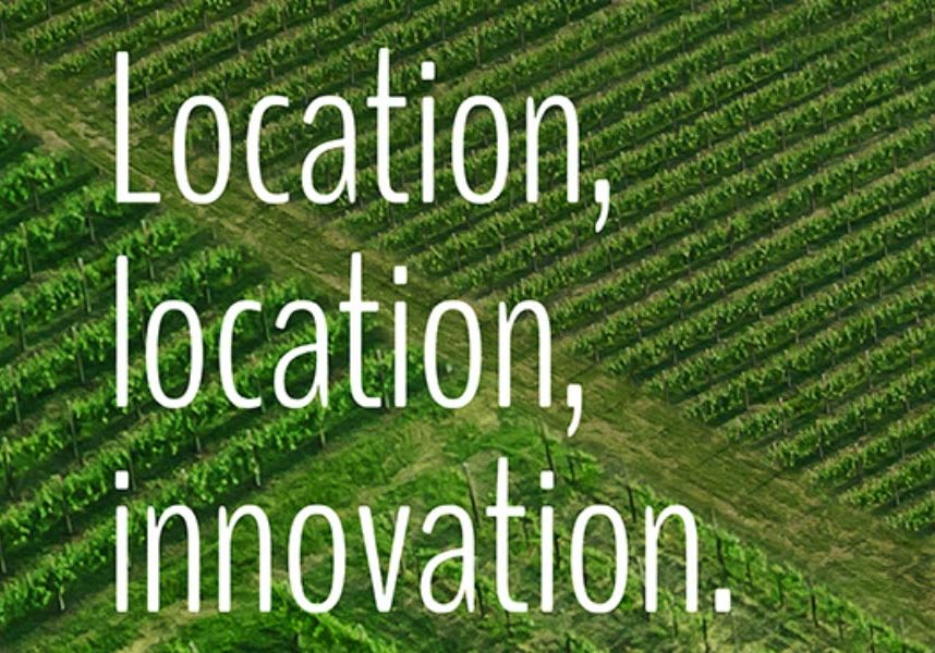Field with text overlay "Location, Location, Innovation."